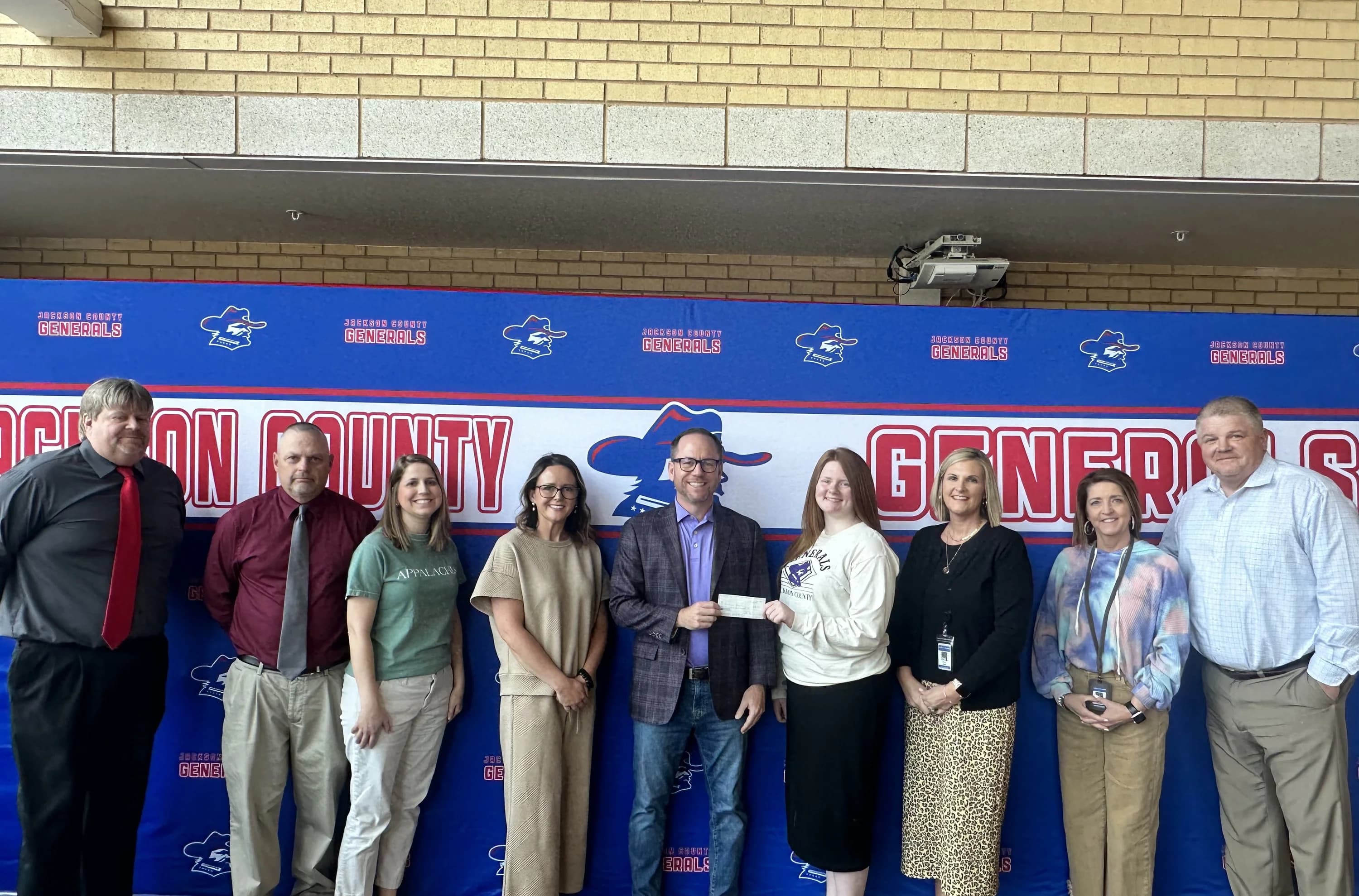 Boom Edu team and community partners at a school partnership event